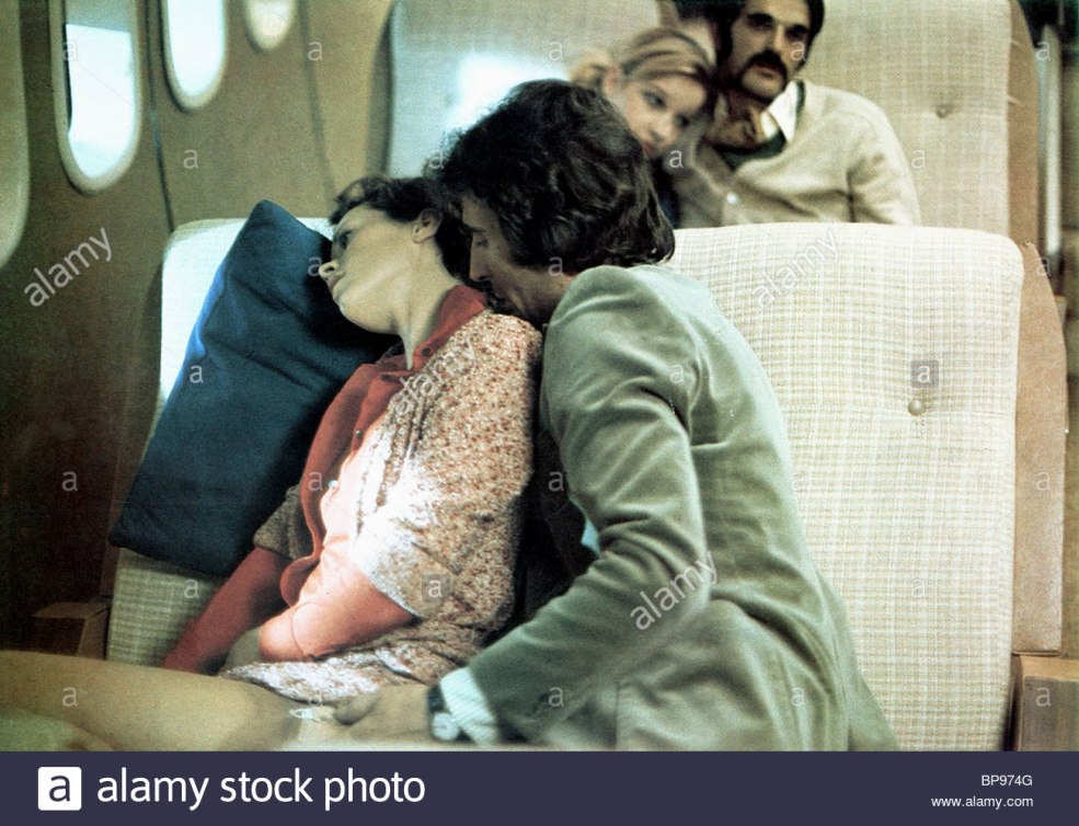 Sylvia Christel Scene dans un avion